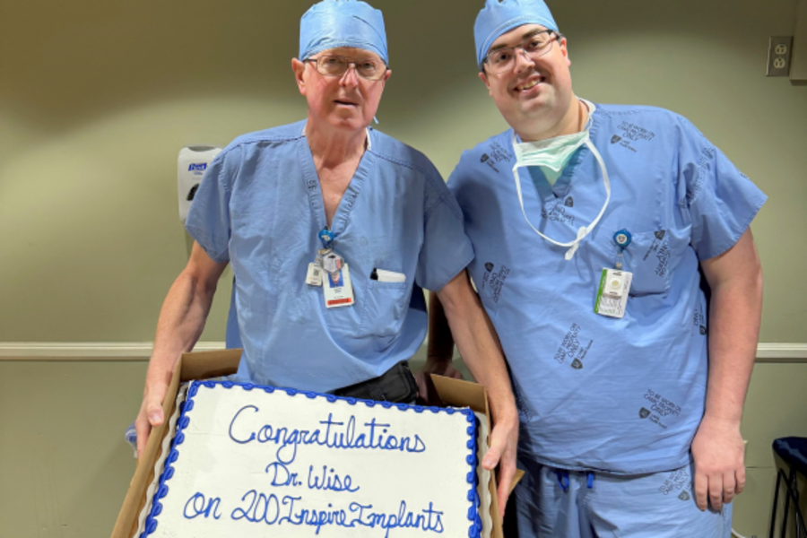 Dr. Wise with a cake