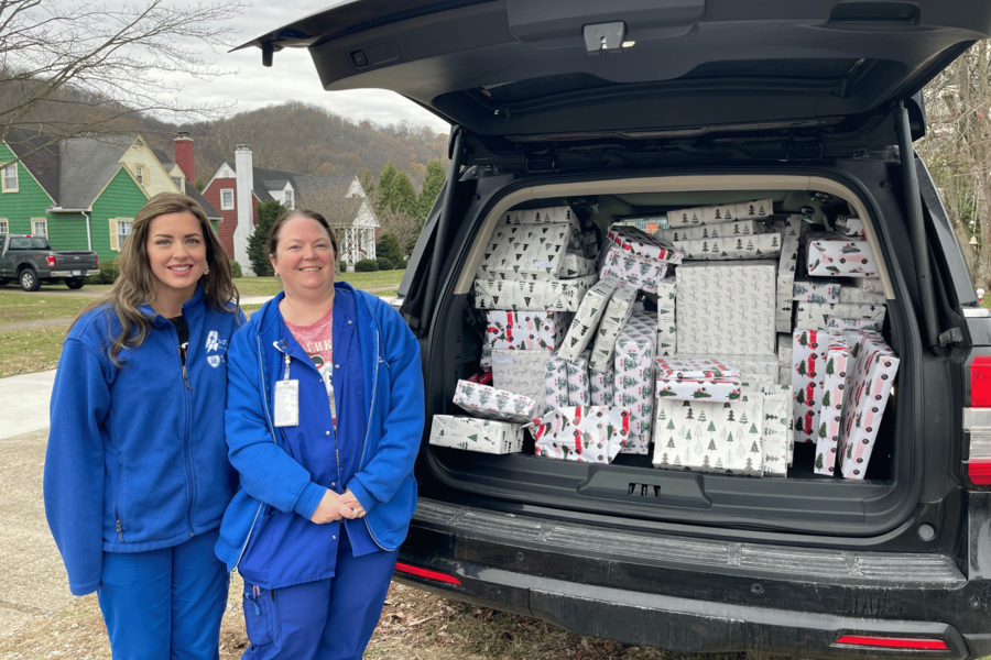 An image of several members of the workforce with the gifts they brought.