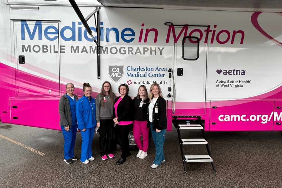 Members of the workforce in front of the new mammography unit.