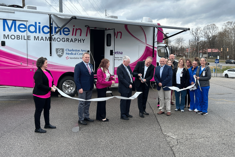 Members of leadership cutting the ribbon for the new units.