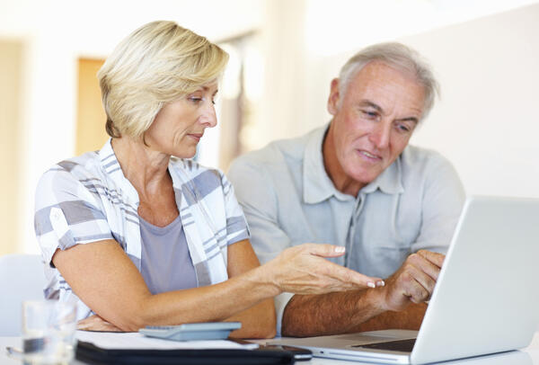 Couple looking at laptop